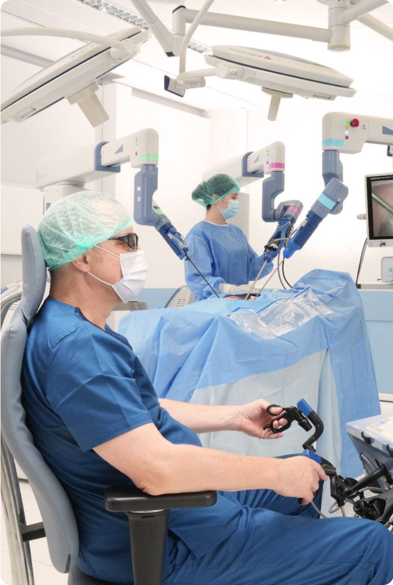 Photo of surgeon sitting in chair, performing surgery